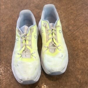 On Running Yellow and Gray Sneakers